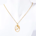 Macro view of Sagittarius gold necklace with frosted finish and yellow gemstone - Sagittarius