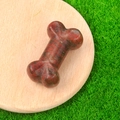 Miniature 35mm bone-shaped natural red agate crystal stone carving with deep textures - Sesame Stone