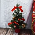 Mini green artificial Christmas tree with red bows and gold cones in a red base pot - 30cm / Red
