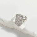Silver open ring with a rectangular zircon-encrusted face on a minimalist stone background - Rectangle