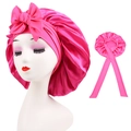 Detail of hot pink satin sleep cap featuring large bow decoration and long elastic ties - Cross-Rose Red