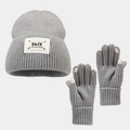 Detail view of a thick grey knit winter set featuring a beanie hat and full finger gloves - Gray