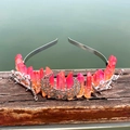 Detail showing orange crystal clusters with moon and branch metal ornaments on headband - Red Orange