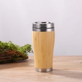 Insulated bamboo travel mug with stainless steel lid on a rustic wooden surface - Bamboo Shell Car Mug with Steel Lid