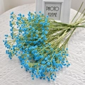 Artificial blue baby's breath flower bouquet on a white lace tablecloth - Dark Blue