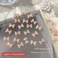 Ciondoli per nail art a fiocco in resina rosa arancio traslucida 8x6mm 50 pezzi - 50 Pezzi/Confezione / Rosa Arancio