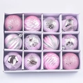 Top view of 12 mixed texture pink Christmas ornaments in a white grid display box - Set of 12 / Pink