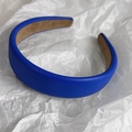 Detail of Klein blue faux leather headband featuring lychee texture and soft brown lining - Klein Blue