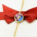 Golden bracelet with round abalone shell pendant featuring an engraved letter P design - Letter P