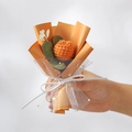 Handmade knitted orange yarn flower bouquet wrapped in white mesh with gold stars - Knitted Champagne Tulip