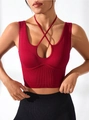 Close-up of ribbed burgundy sports bra with halter criss-cross straps and front cutout - S / Tops / Red