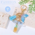 Blue ocean beach style alphabet T keychain with whale tail, resin shells and tassel - Letter T