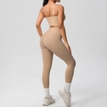 Close-up of matte nude yoga set showing open back sports bra and high-waist leggings - Medium Khaki