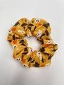 Close-up of orange Halloween scrunchie with cats, ghosts, and witch hats prints - Ghost Spider Print Large 11cm