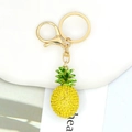 Detail of pineapple keychain featuring yellow rhinestones and green enamel leaf accent - Yellow Full Rhinestone Pineapple Keyring