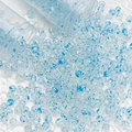 Close-up of 8mm blue spotted glass beads spilling from tubes for DIY jewelry making - 8mm Spotted Beads / Lake Blue