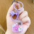 Cute purple liquid sand backpack keychain with miniature bell and cookie charms - Mini Backpack - Purple