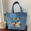 Blue denim tote bag with colorful baseball embroidery and top handles on wooden background - Denim Baseball-Normal