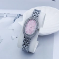 Macro detail of oval pink dial with crystal bezel and silver link strap on watch - Silver Pink