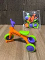 Mini toy tricycle with orange frame, green wheels and purple handle for keychains - Assembly Tricycle / Orange