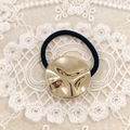 Minimalist alloy hair tie with a textured gold round disc on black elastic band - Gold Round Textured