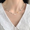 Macro detail of colorful beaded necklace featuring a white flower pendant and silver beads - Colorful Small Beads Spliced White Flower Pendant Necklace (17#)
