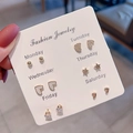 Detailed view of 6 pairs of gold-tone stud earrings with zircon on a Monday to Saturday card - Gold Star Moon Heart Combination (E1346-1)