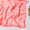 Pink muslin baby blanket featuring a white sun pattern made of soft breathable cotton - Pink White Sun