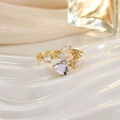 Detail shot of golden flower ring with heart-shaped purple stone and 925 silver hallmark - Purple Heart Floral Leaf Decor (JZ0152A)