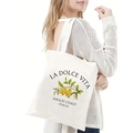 Detail of white canvas tote bag featuring Italian Amalfi Coast lemon print and sturdy straps - Amalfi Coast Lemon Print