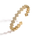 Detailed close-up of clover-shaped gold bangle with sparkling zircon pavé crystal petals - Gold White Zirconia Clover Bangle