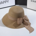 Detailed texture of hand-woven straw hat featuring a brown mesh ribbon bow decoration - M (56-58cm) / Khaki