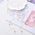 Gold plated eyewear chain featuring star pendant with zircon on a white decorative plate - Small Star / Gold