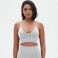 Detailed close-up of seamless light grey sports bra with V-neck and thin shoulder straps - S / Moonlight White