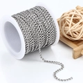 Roll of stainless steel Cuban link chain for DIY jewelry making on white spool - 3mm / Steel