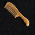 Green sandalwood hair comb with ergonomic round handle and fine teeth on black velvet - Style 1/Length 20cm