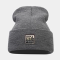 Detailed knit texture of dark grey beanie featuring a vintage denim supplies fabric patch - One Size / Dark Gray