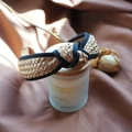 French vintage raffia woven headband in beige with black fabric trim on silk background - Beige Black Edge Knotted