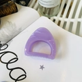 Close-up of a glossy lavender semi-circular hair claw clip on an open book page - Medium (approx. 6cm) / Taro Purple