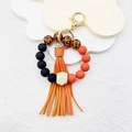 Silicone bead keychain with leopard print, orange tassel, and natural wooden hex bead - Orange Red Leopard