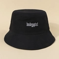 Black cotton bucket hat with white Babygirl gothic embroidery on a beige background - One Size / Black