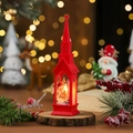 Detail shot of a red Christmas church lantern with warm LED light on wooden base - A Red Old Deer Pulls A Cart
