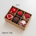 Set of 6 handcrafted 5cm wool felt Christmas balls in red and green with festive patterns - Three-Color Hearts