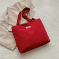 Red corduroy tote bag with Fashion Instinct label placed on neutral background - Burgundy