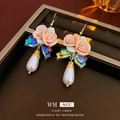Pink ceramic rose earrings with iridescent bow and teardrop pearl on gold hooks - Ear Hook-Flower Pearl Earrings
