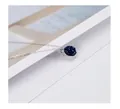 Macro detail of a round blue sandstone pendant on a minimalist 925 sterling silver chain - Necklace