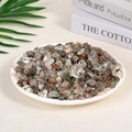 Mixed natural tumbled crystal stones in various colors displayed on a white round tray - Green Phantom Quartz (7-9mm) 100g