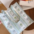 Detail of blue striped cotton tote bag featuring vintage illustration and sturdy handles - Light Blue Striped Girl