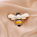 Cute bee brooch with pearl and sparkling zircons on a champagne satin background - Style 4