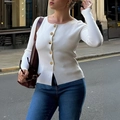 Women's minimalist white long sleeve knit shirt with golden buttons in a city street view - White / XS